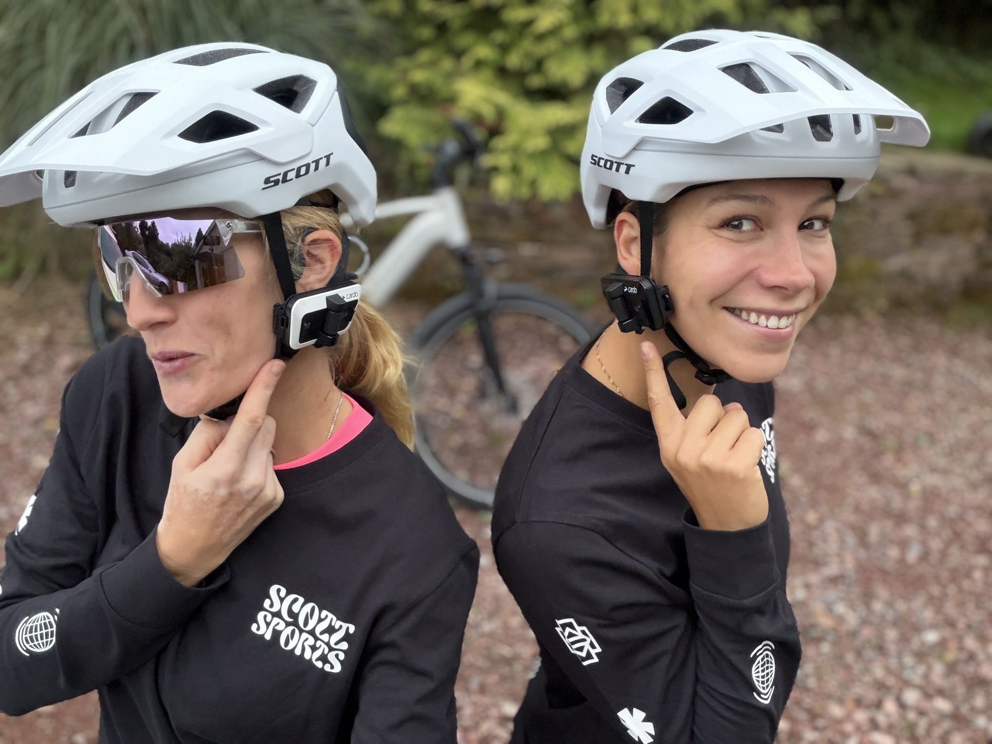 Vanessa Ruck and Tori wearing SCOTT cycling helmets and Cardo intercoms while preparing for their Turkey cycling expedition