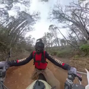 A rider travelling along a forest trail in Tasmania, from Vanessa Ruck’s motorcycle adventure video